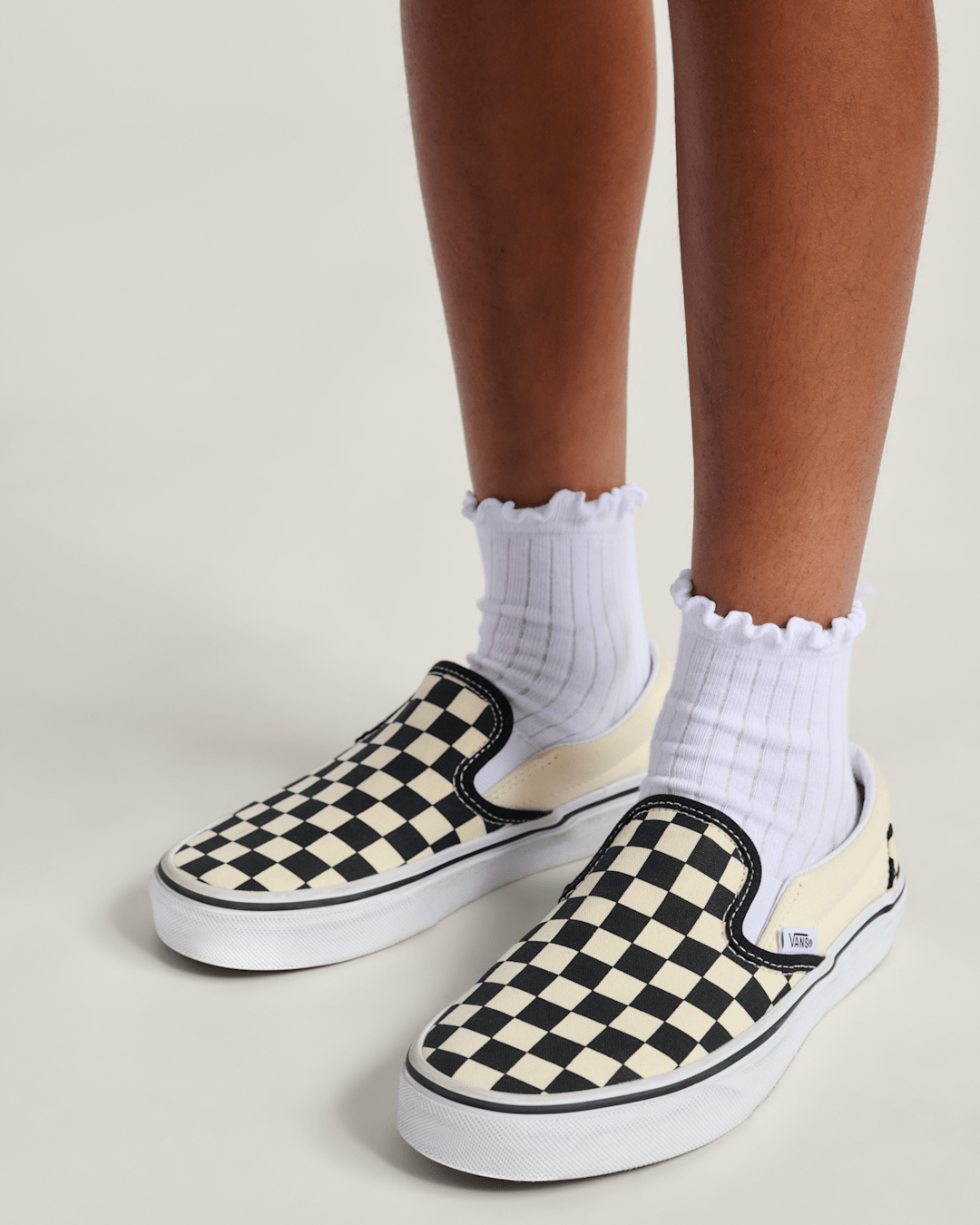 Kids Vans Big Kids Classic Slip-On Shoe in Checkerboard Black / White