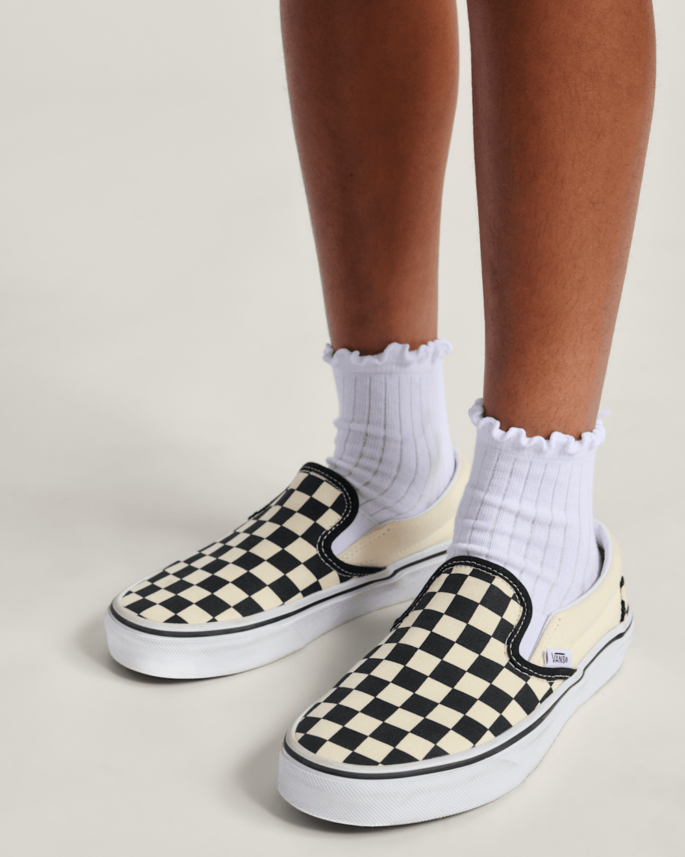 Kids Vans Big Kids Classic Slip-On Shoe in Checkerboard Black / White
